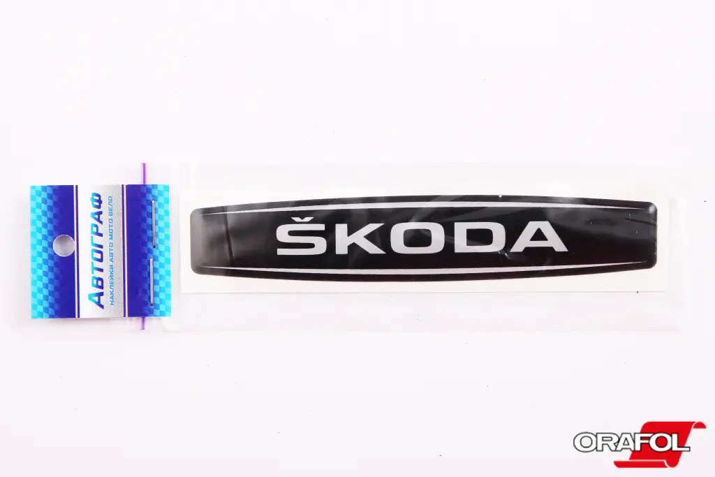 наклейка Эмблема силикон Skoda черный фон, серебр. 2*12см 