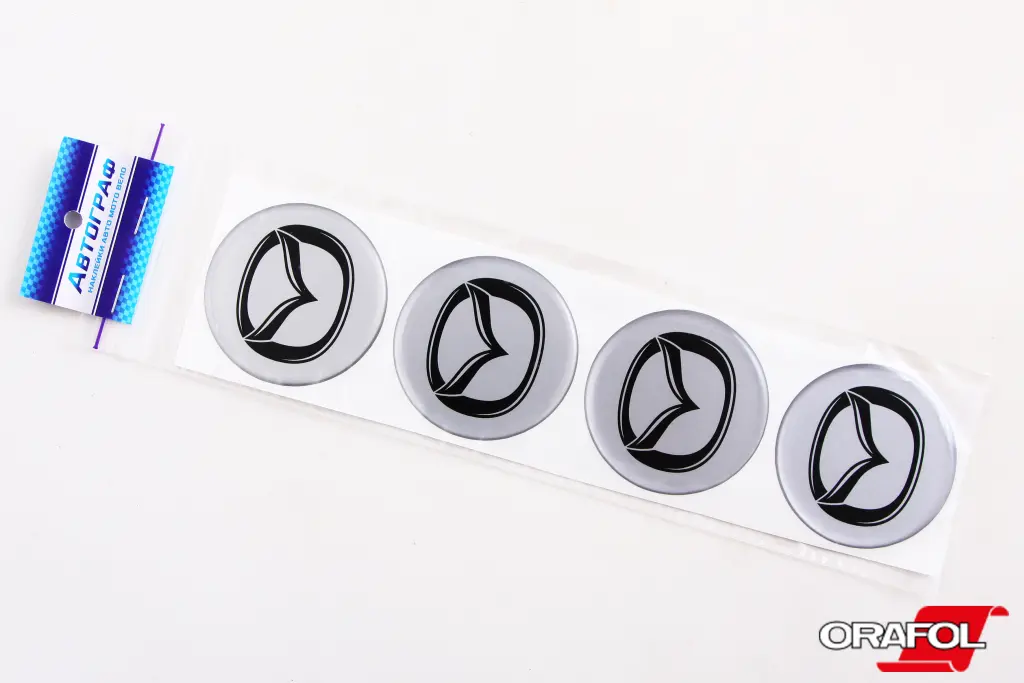 наклейка на ковпак 55мм силікон Mazda срібл. 
